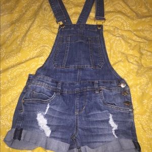 Blue ripped overalls